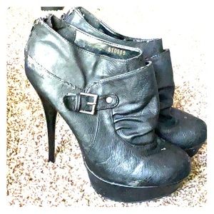 Black leather heeled booties